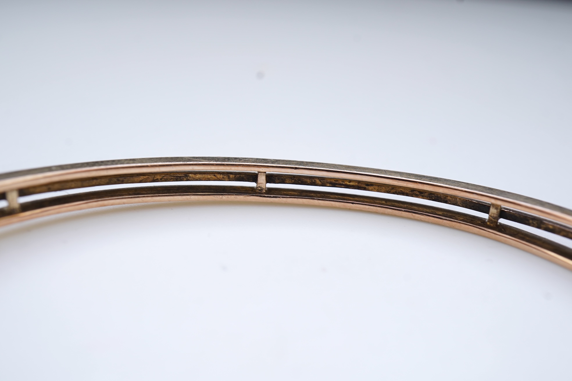 An Edwardian seed pearl and diamond bangle, early 20th century